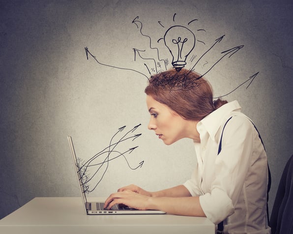 Illustration of a woman sitting at a desk using a laptop. A lightbulb shines brightly above her head, symbolizing an idea. Lines and charts representing data float near her, suggesting she is incorporating insights into her blog post.